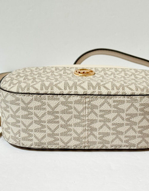 Load image into Gallery viewer, MICHAEL KORS JET SET GLAM SMALL FRONT POCKET OVAL CROSSBODY BAG MK LIGHT CREAM
